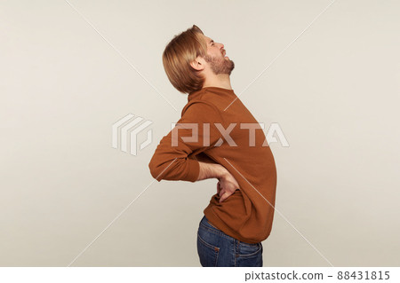 Portrait of emotional bearded man on gray background. 88431815