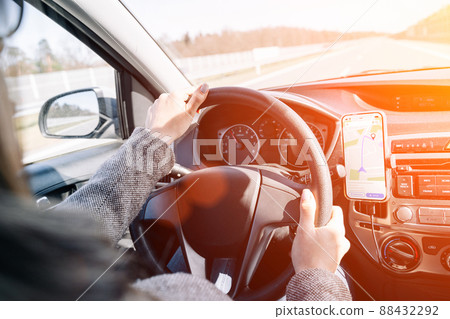 Gps navigator map system. Global positioning system on smartphone screen in auto car on travel road. GPS car search location technology. Gps navigator map system. Global positioning system on smartphone screen in auto car on travel road. GPS car search location technology. 88432292