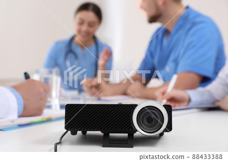 Video projector on table during medical conference 88433388