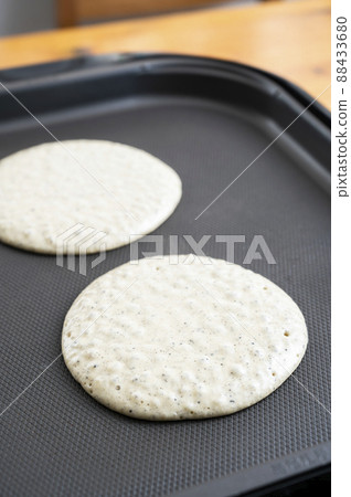 Bake pancakes on a hot plate 88433680