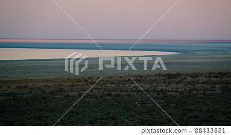 Panorama view to Aral sea from the rim of Plateau Ustyurt near Aktumsuk cape at sunset, Karakalpakstan, Uzbekistan 88433881