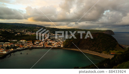 Sunset view to Horta, Porto Pim Bay and beach from mount Guia, Faial island, Azores, Portugal Sunset view to Horta, Porto Pim Bay and beach from mount Guia, Faial island, Azores, Portugal 88433924
