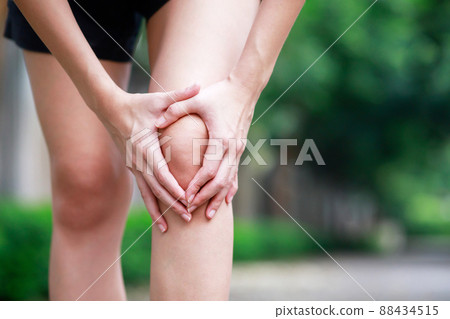 Runner touching painful twisted or broken. Athlete training accident. Sport running sprained sprain cause injury knee. and pain with leg bones. 88434515