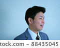 A laughing profile office worker A laughing profile office worker 88435045