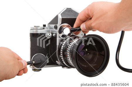 Old Camera Repair with stethoscope. Service of vintage photographic equipment. Old Camera Repair with stethoscope. Service of vintage photographic equipment. 88435604