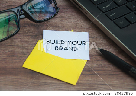 Build your brand text on small piece of paper in an envelope with office background Build your brand text on small piece of paper in an envelope with office background 88437989