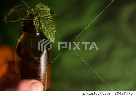 Herbalist Homeopath, space for text. Aromatherapy essential oil, brown bottle. 88438776