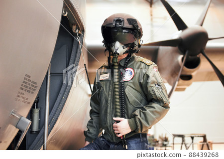Ready for flight. A pilot standing in full gear next to his plane. Ready for flight. A pilot standing in full gear next to his plane. 88439268