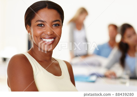 Shes excited to be part of the team. Closeup of a smiling young African woman in a meeting. Shes excited to be part of the team. Closeup of a smiling young African woman in a meeting. 88439280