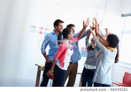 Theres no better work than teamwork. Shot of a group of casually dressed businesspeople in the office. Theres no better work than teamwork. Shot of a group of casually dressed businesspeople in the office. 88439281