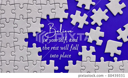 Motivational quote text about believing yourself on blue cover background surrounded by missing jigsaw. Motivational concept. 88439331
