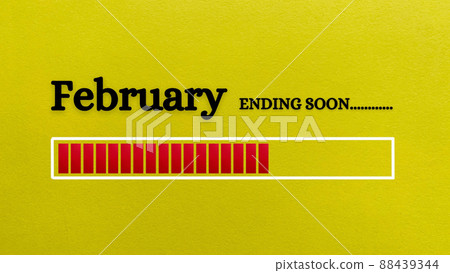 Top view of loading bar showing the end of February month with yellow paper background. Month concept 88439344