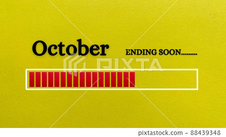 Top view of loading bar showing the end of October month with yellow paper background. 88439348