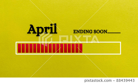 Top view of loading bar showing the end of April month with yellow paper background. Month concept 88439443
