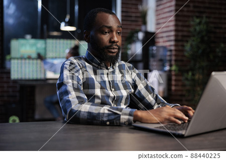 Hedge fund company trader using laptop to predict forex stock market trend and to analyze real time financial data. Trading agency employee in office workspace, working on opened position analysis. Hedge fund company trader using laptop to predict forex stock market trend and to analyze real time financial data. Trading agency employee in office workspace, working on opened position analysis. 88440225