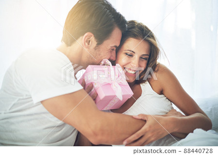 Because youre so special to me. Shot of a loving husband giving his wife a gift. 88440728