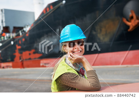 My attitude is never to be satisfied. A confident young woman resting her chin on her hands next to a ship.. My attitude is never to be satisfied. A confident young woman resting her chin on her hands next to a ship.. 88440742