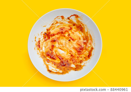 Dirty dish on yellow background. Top view Dirty dish on yellow background. Top view 88440961