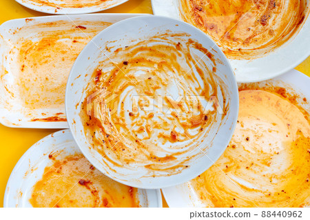 Dirty dish on yellow background. Top view Dirty dish on yellow background. Top view 88440962
