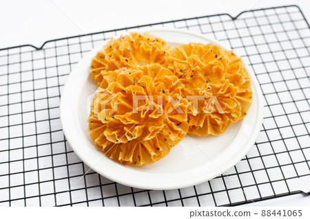 Crispy lotus blossom cookie in white background. Crispy lotus blossom cookie in white background. 88441065