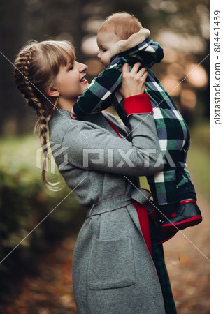 Beautiful caucasian mother with braid embracing Beautiful caucasian mother with braid embracing 88441439