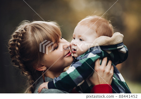 Beautiful caucasian mother with braid embracing Beautiful caucasian mother with braid embracing 88441452