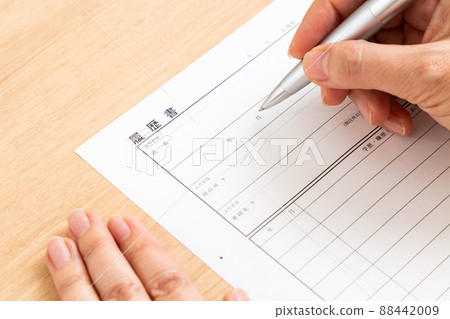 Middle woman writing resume Middle woman writing resume 88442009