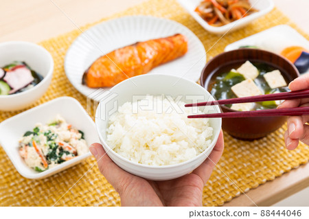 Middle woman eating Japanese food (white rice) Middle woman eating Japanese food (white rice) 88444046