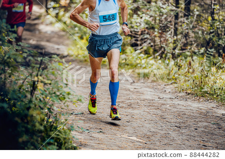 male athlete runner run forest trail marathon 88444282