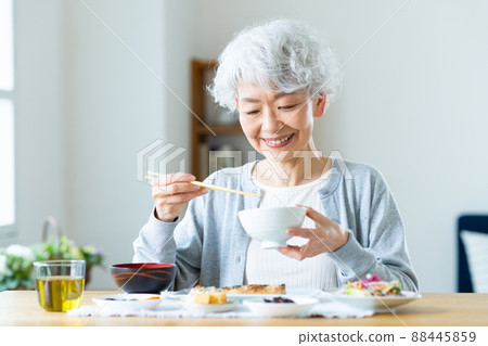 Senior woman eating Senior woman eating 88445859