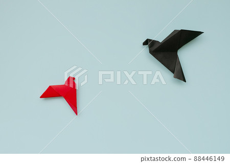 banner two doves made of origami paper in red and bluck colors on pastel background 88446149