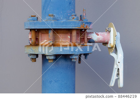 closeup water pipes of industry building watering system at roof top outdoor pipe valve with handle lock. closeup water pipes of industry building watering system at roof top outdoor pipe valve with handle lock. 88446219
