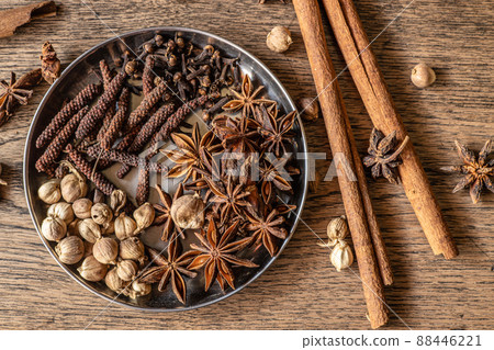 Assorted dry herbal mix indian spice herb natural meditation on wood background Assorted dry herbal mix indian spice herb natural meditation on wood background 88446221