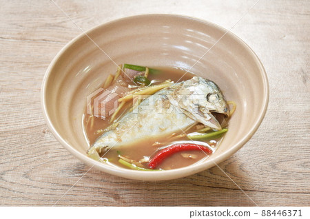 boiled mackerel with ginger spicy and sour soup on bowl 88446371