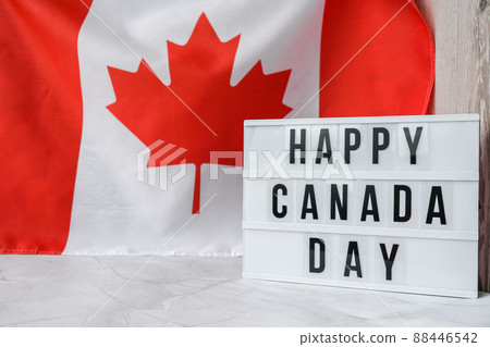 The National Flag of Canada. Lightbox with text HAPPY CANADA DAY Canadian Flag or the Maple Leaf. Patriotism. International relations concept. Independence day The National Flag of Canada. Lightbox with text HAPPY CANADA DAY Canadian Flag or the Maple Leaf. Patriotism. International relations concept. Independence day 88446542