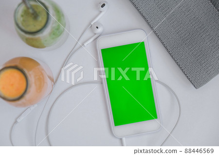 Seasonal Matcha green vegan smoothie and pumpkin carrot smoothie drink detox Breakfast with mobile phone chroma key screen and rubber resistance band. Stretch fitness band. Clean eating, weight loss, Seasonal Matcha green vegan smoothie and pumpkin carrot smoothie drink detox Breakfast with mobile phone chroma key screen and rubber resistance band. Stretch fitness band. Clean eating, weight loss, 88446569