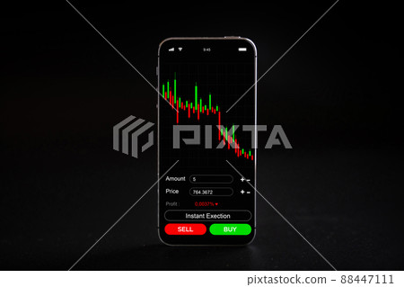 Crypto currency exchange. Pink pig bank, gold crypto currency BTC bitcoin on black background. Bitcoin trading mobile phone app. Save money investment and business finance. 88447111