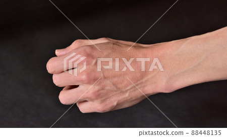 Lean man's arm and raised blood vessels 88448135