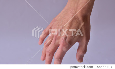 Skinny male hands and raised blood vessels 88448405