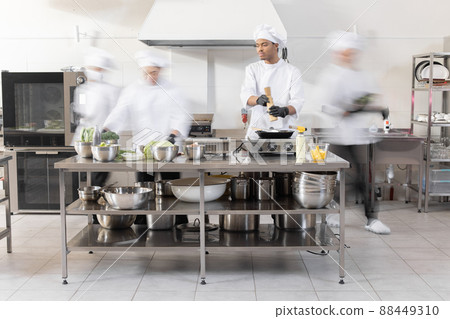 Chef cooks working in professional kitchen Chef cooks working in professional kitchen 88449310