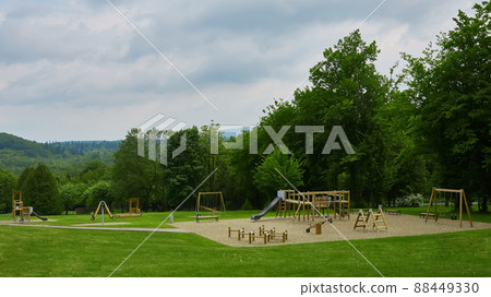 Colorful playground on yard in the park. Colorful playground on yard in the park. 88449330