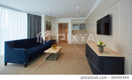 A modern livingroom inside a new flat with TV. 88449364