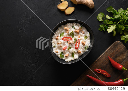 Curd Rice with pomegranate, cilantro, mustard seeds, ginger. Curd Rice with pomegranate, cilantro, mustard seeds, ginger. 88449429