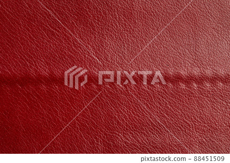 Red leather texture background. Luxury genuine textile surface material wallpaper with furniture backdrop. Close up of fashion fabric 88451509