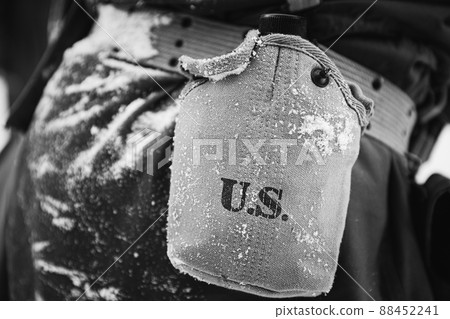 American Military Ammunition Of A US Soldier At World War II. Warm Autumn Clothes, Flask. Photo In Black And White Colors American Military Ammunition Of A US Soldier At World War II. Warm Autumn Clothes, Flask. Photo In Black And White Colors 88452241
