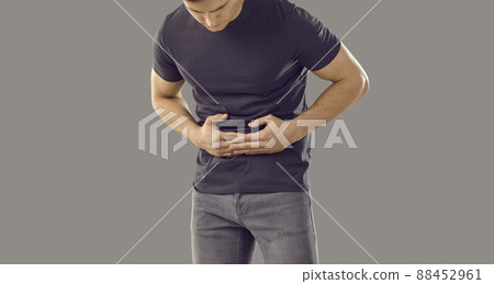 Sick man touch belly struggle with stomachache Sick man touch belly struggle with stomachache 88452961