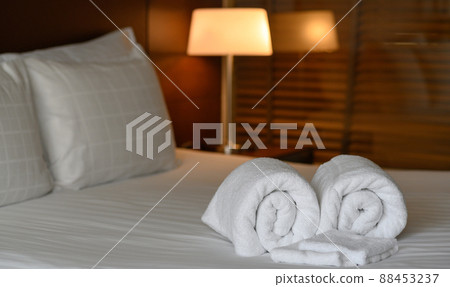 Clean white towel set on bed in hotel bedroom, relax, holiday, vacation concept. Clean white towel set on bed in hotel bedroom, relax, holiday, vacation concept. 88453237