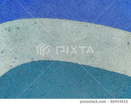 Blue rubber surface anti-traumatic safety tile for workout sports playground in public park or courtyard. The background. Texture. 88454910
