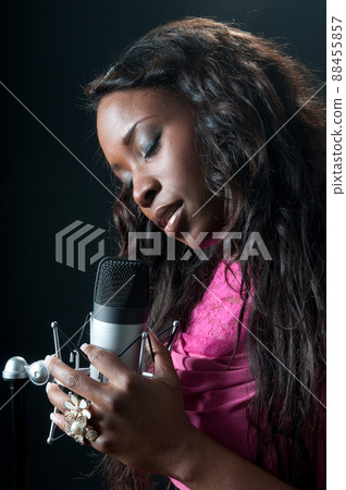 African-American soul, jazz, or blues singer rehearsing with his microphone 88455857