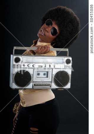 African American soul, jazz or blues singer with a vintage cassette player African American soul, jazz or blues singer with a vintage cassette player 88455886